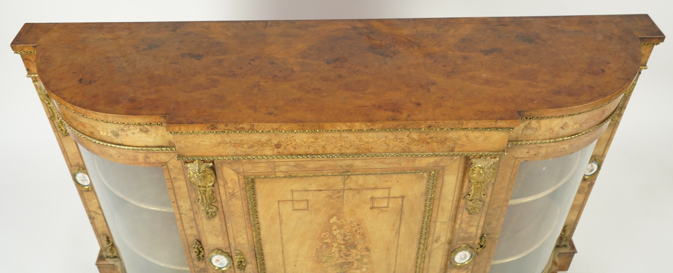 A Victorian marquetry inlaid, gilt metal mounted bowfront side cabinet